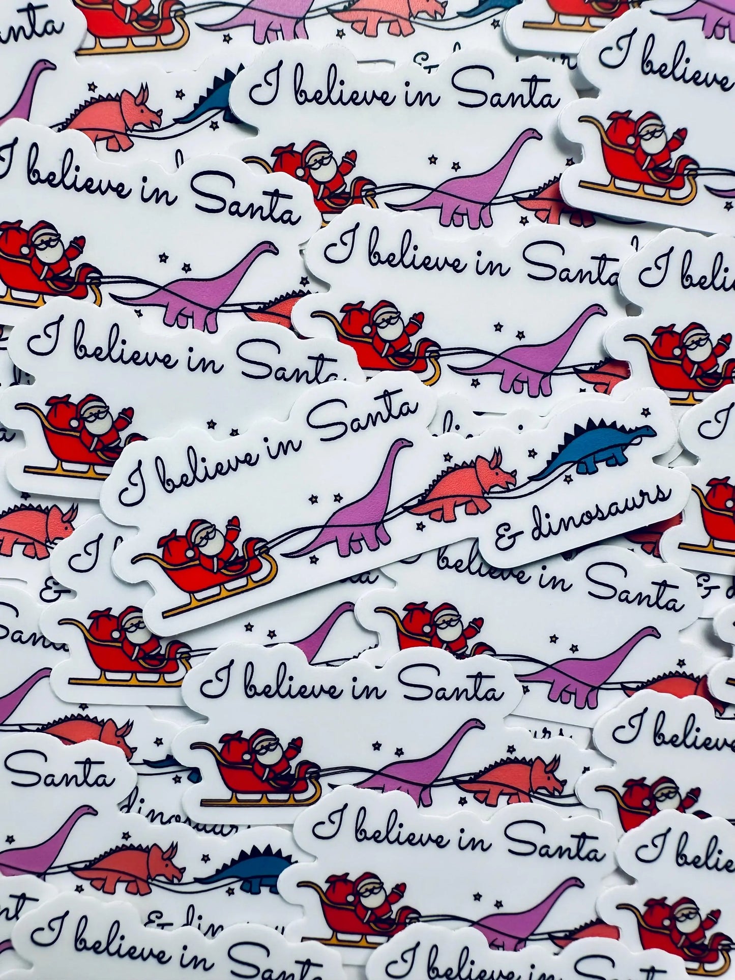 I believe in Santa and Dinosaurs Weatherproof Sticker, Funny Holiday Season Sticker, Trendy Sticker for Kindle, Laptop, Water Bottle maedaymaedaymaeday
