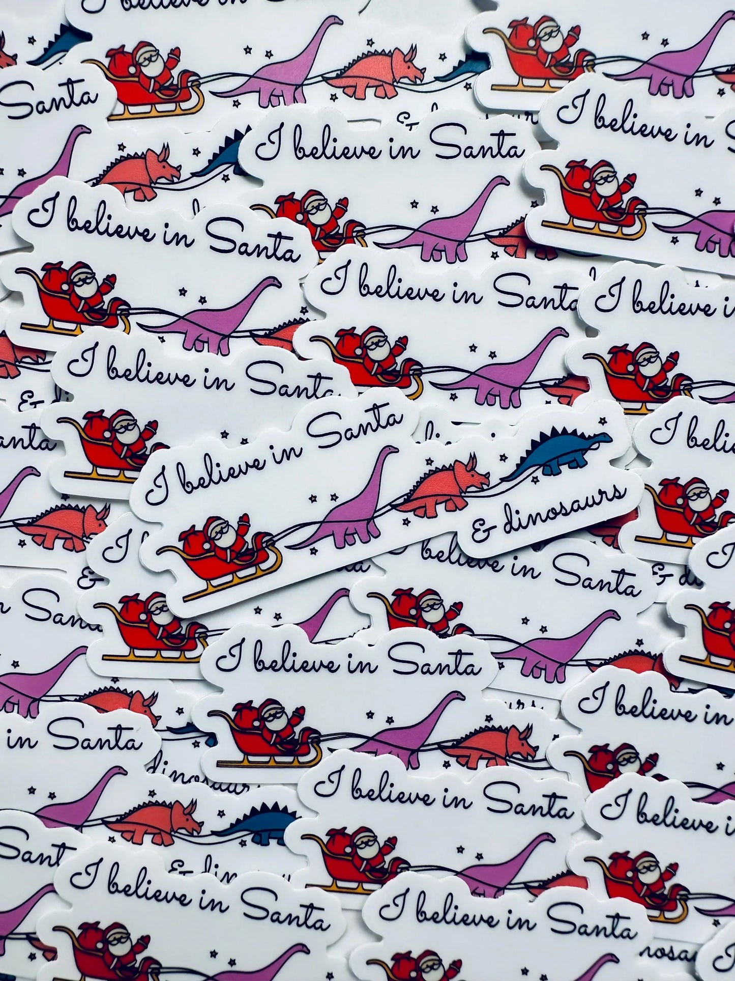 I believe in Santa and Dinosaurs Weatherproof Sticker, Funny Holiday Season Sticker, Trendy Sticker for Kindle, Laptop, Water Bottle maedaymaedaymaeday
