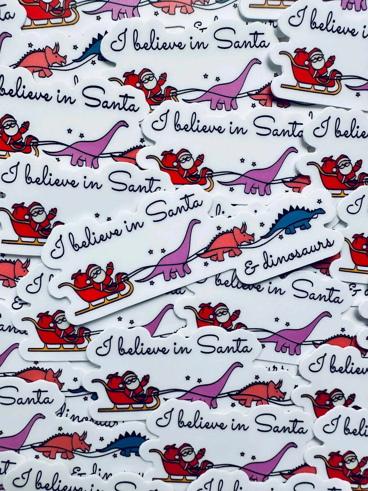 I believe in Santa and Dinosaurs Weatherproof Sticker, Funny Holiday Season Sticker, Trendy Sticker for Kindle, Laptop, Water Bottle maedaymaedaymaeday