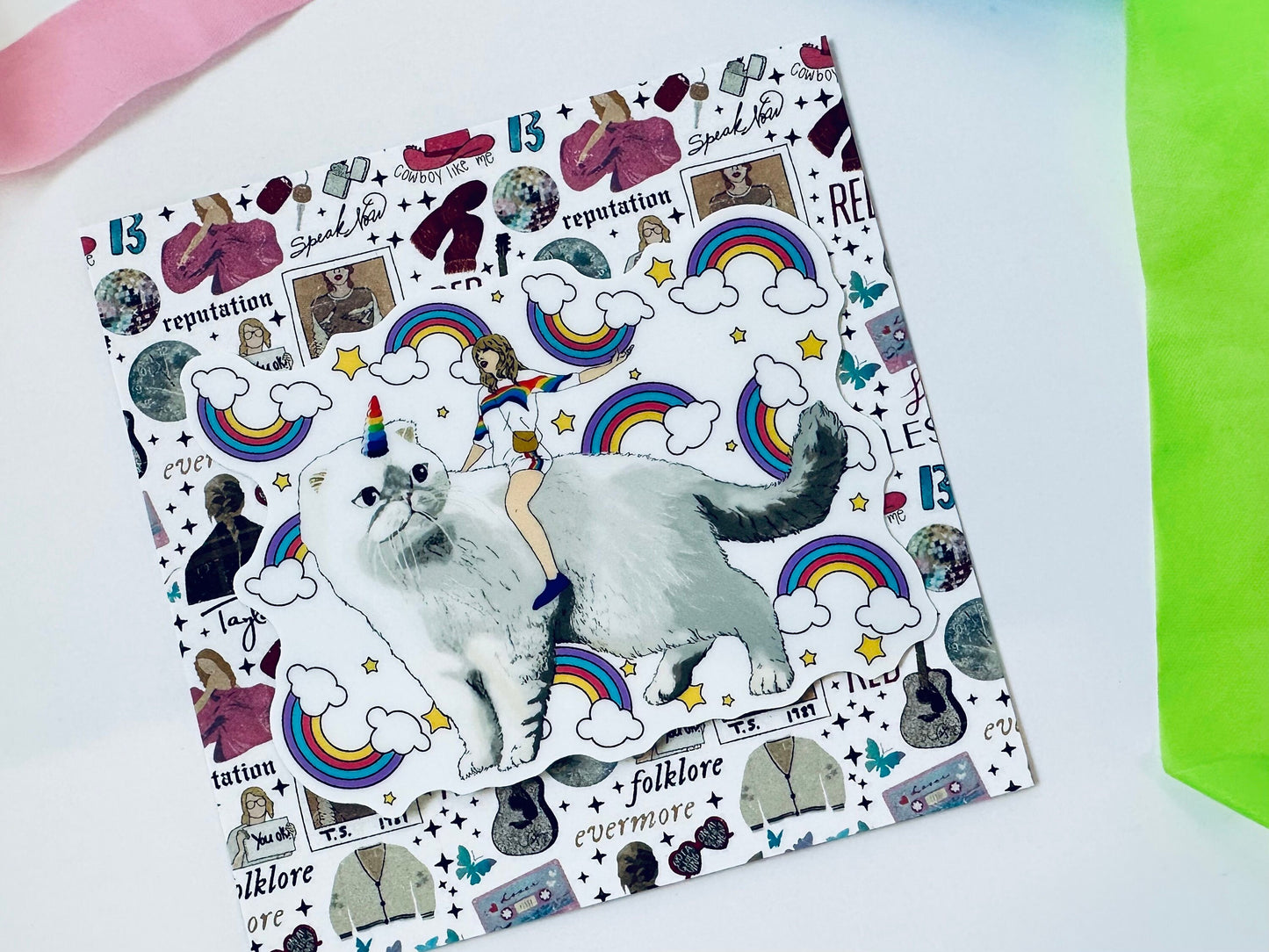 Taylor Riding Cat through Forest, #caticorn commercial, Swift Riding Olivia Benson, Olivia's Rainbow Unicorn Horn, Swiftie Sticker maedaymaedaymaeday