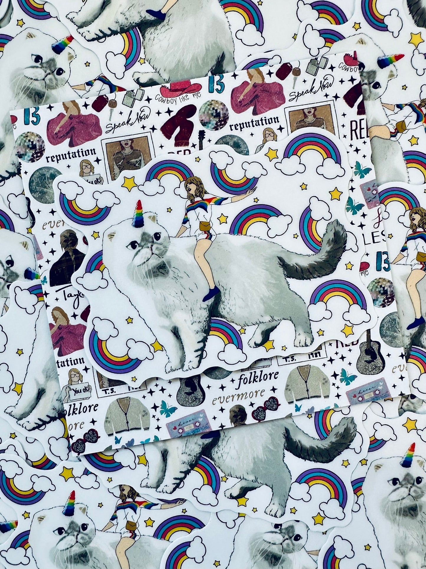 Taylor Riding Cat through Forest, #caticorn commercial, Swift Riding Olivia Benson, Olivia's Rainbow Unicorn Horn, Swiftie Sticker maedaymaedaymaeday