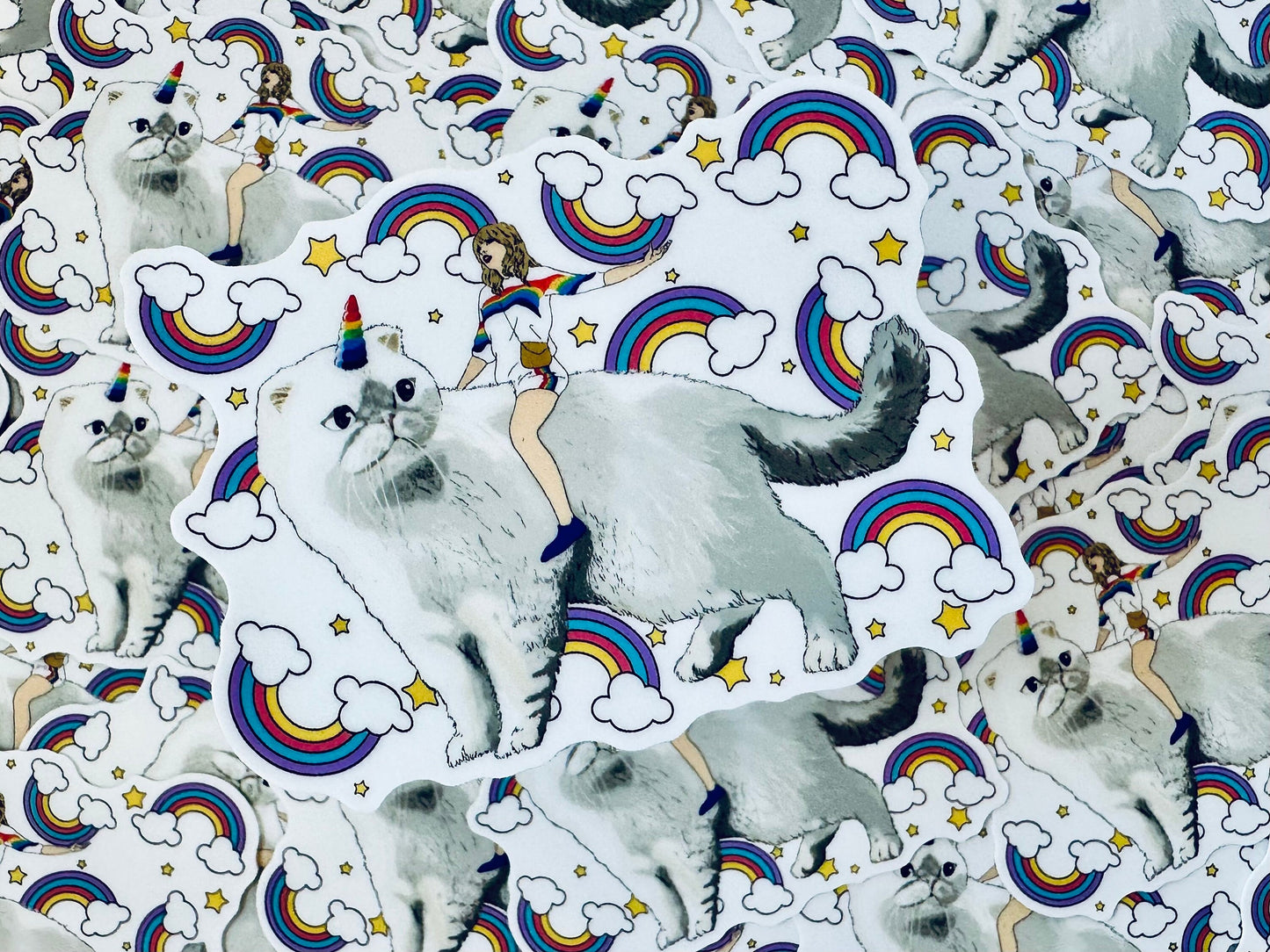 Taylor Riding Cat through Forest, #caticorn commercial, Swift Riding Olivia Benson, Olivia's Rainbow Unicorn Horn, Swiftie Sticker maedaymaedaymaeday